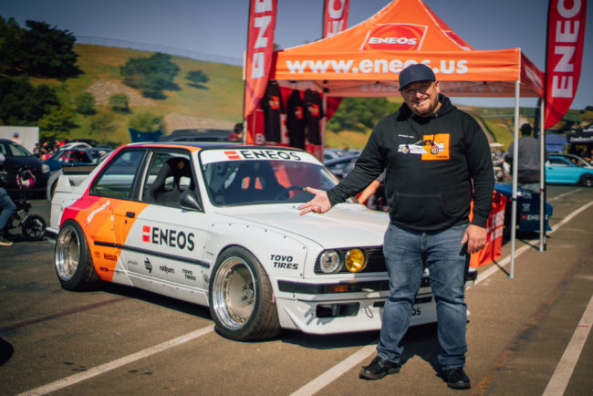 ENEOS Faruk in front of car