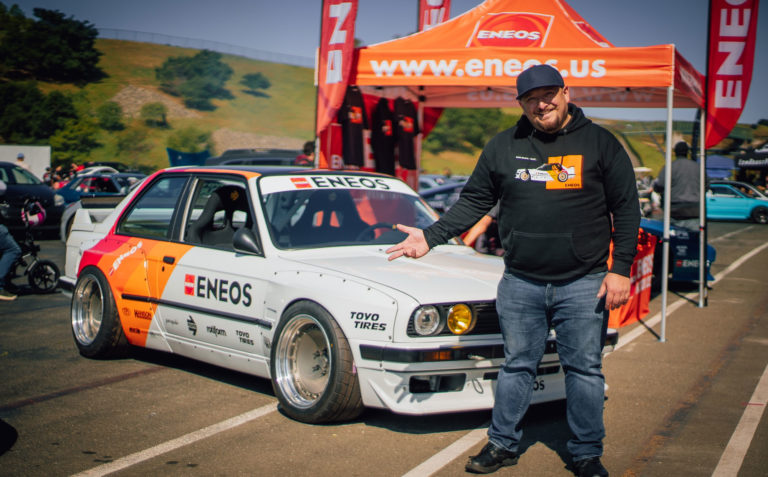 ENEOS Faruk in front of car