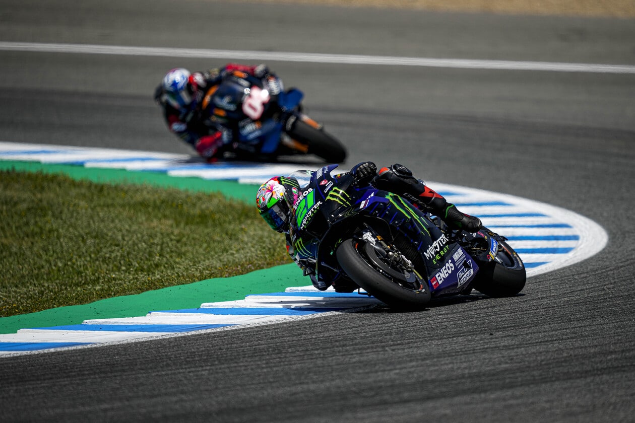 MotoGP riders making a turn on track