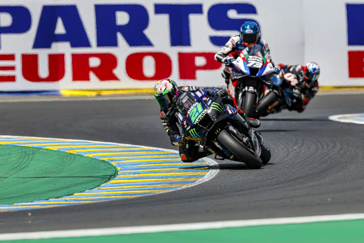 Three MotoGP racers turning on track