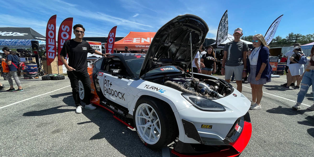 Dai Yoshihara with Pit Paddock car's hood open