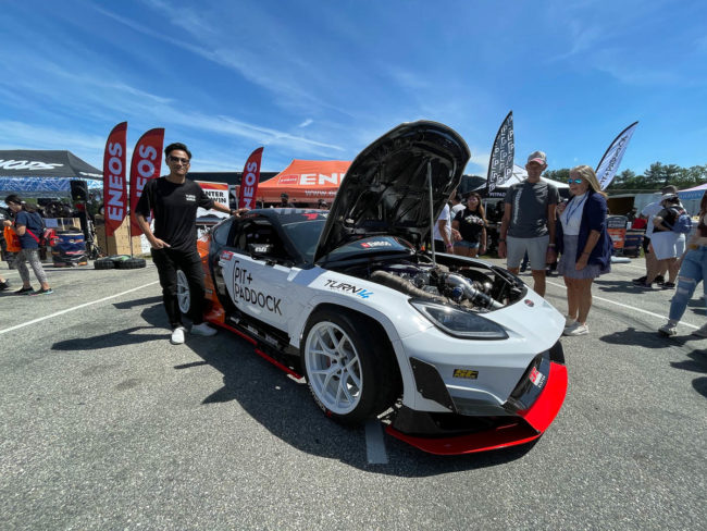 Dai Yoshihara with Pit Paddock car's hood open