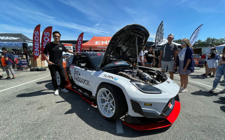 Dai Yoshihara with Pit Paddock car's hood open