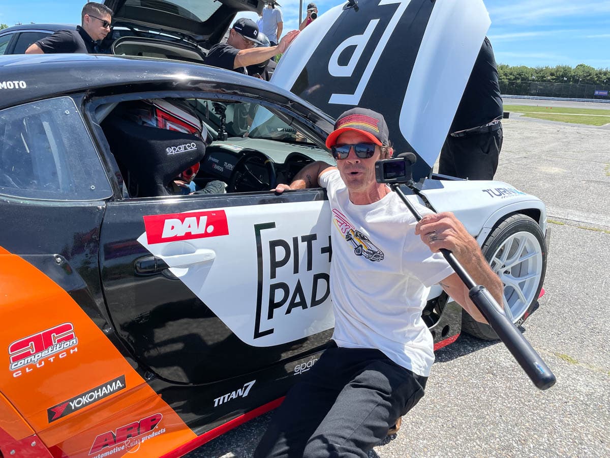 Camera man with Pit Paddock car