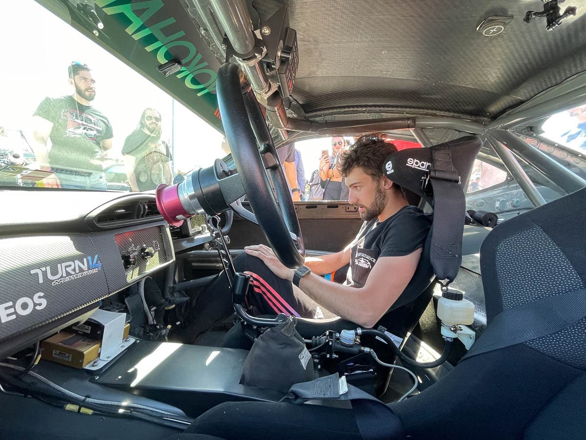 Man sitting in race car