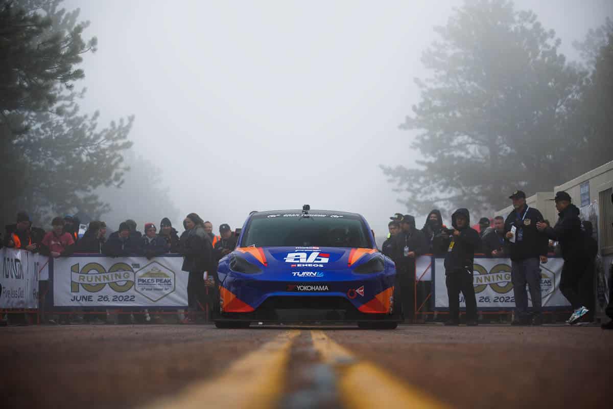 Pikes Peak front view of car on street with crowd behind it