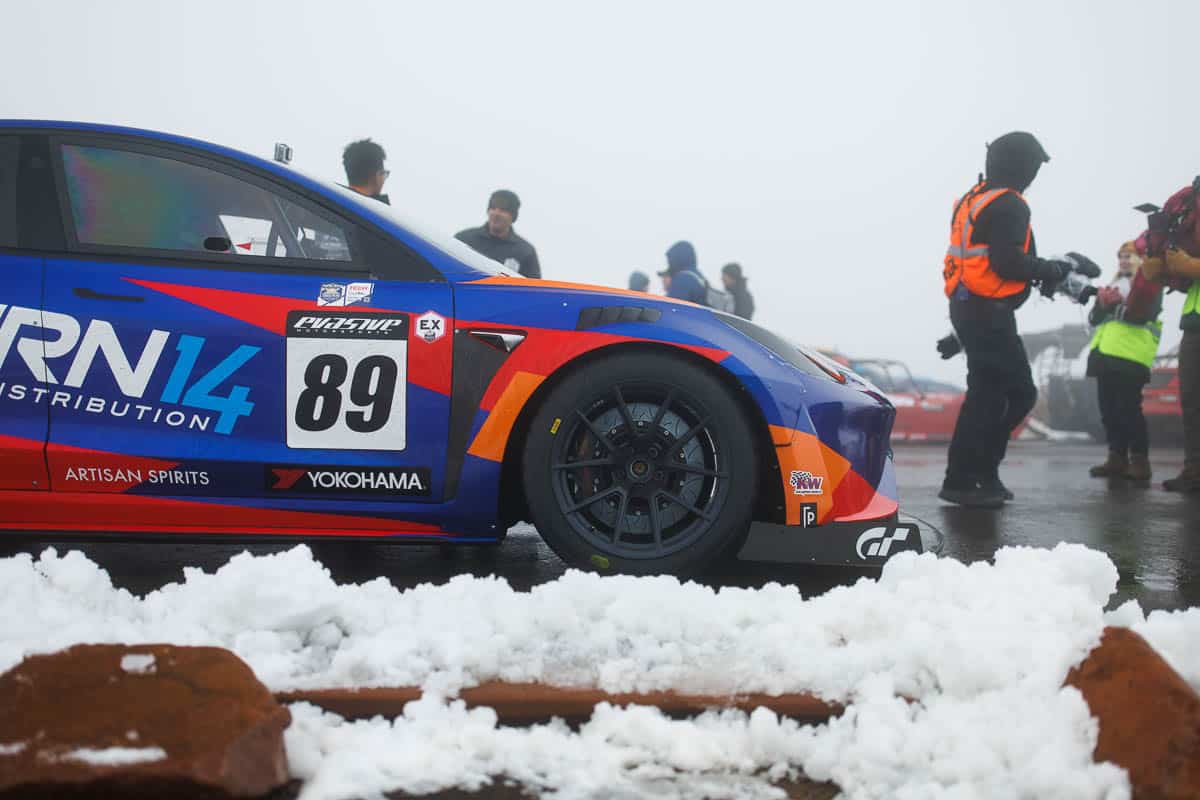 Pikes Peak car parked by snow