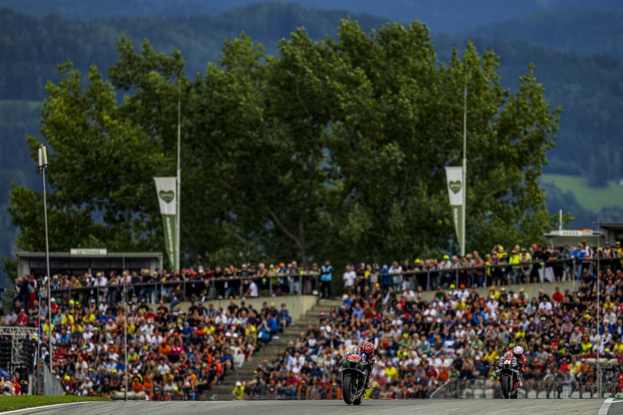 Austrian MotoGP Racers and Stadium Audience View Austrian MotoGP Racers and Stadium Audience View