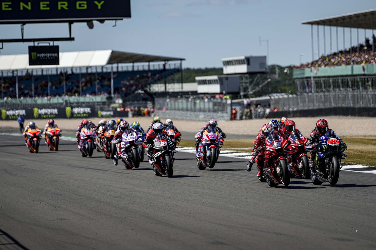 Group of MotoGP racers on british track Group of MotoGP racers on british track