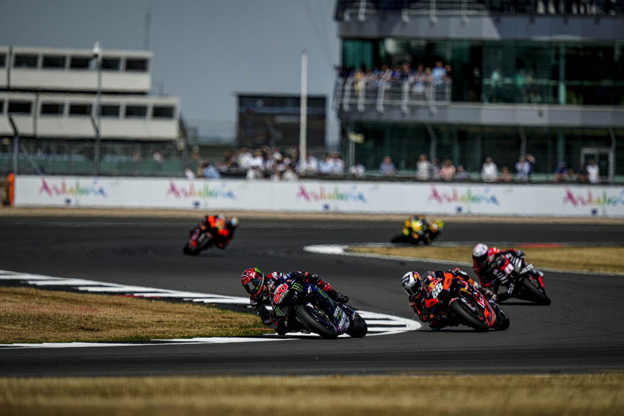 Multiple MotoGP racers making a turn