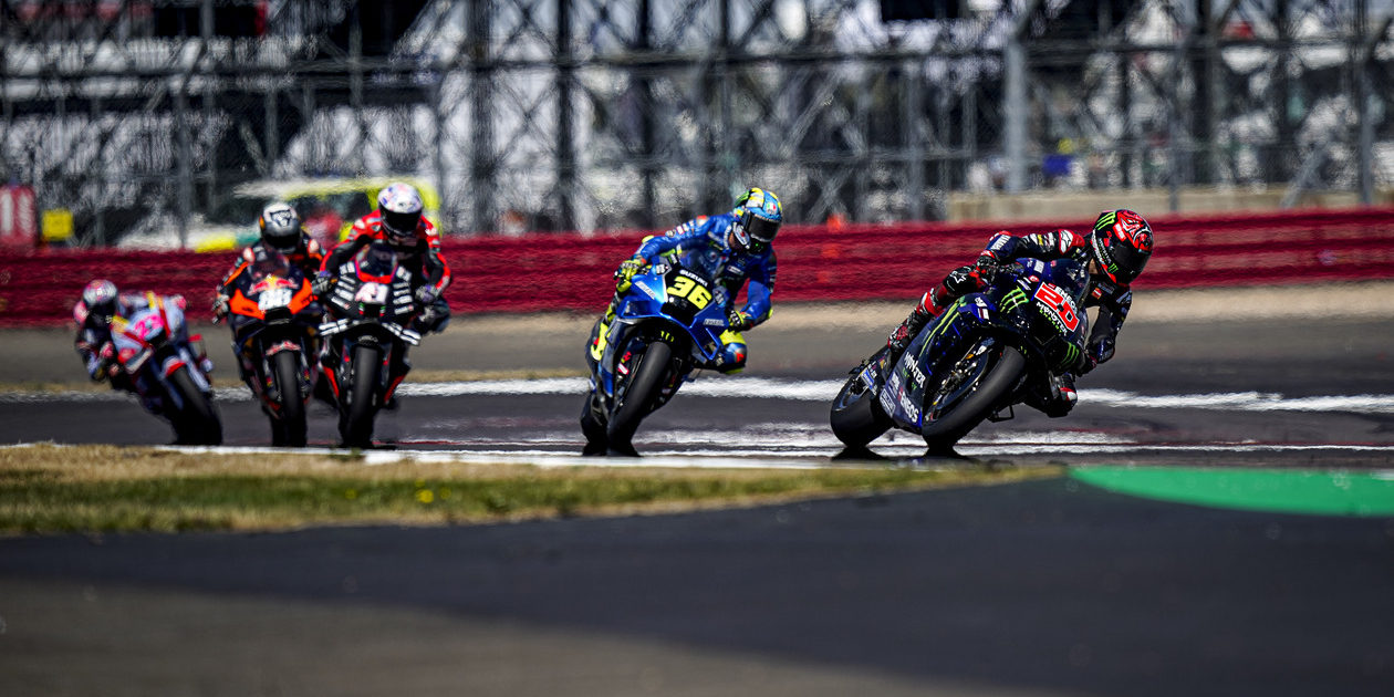 Five MotoGP racers racing on track