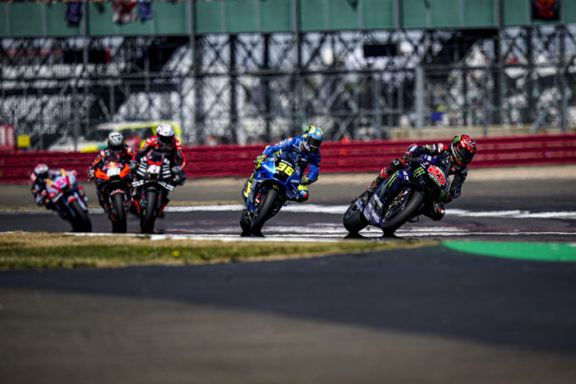 Five MotoGP racers racing on track