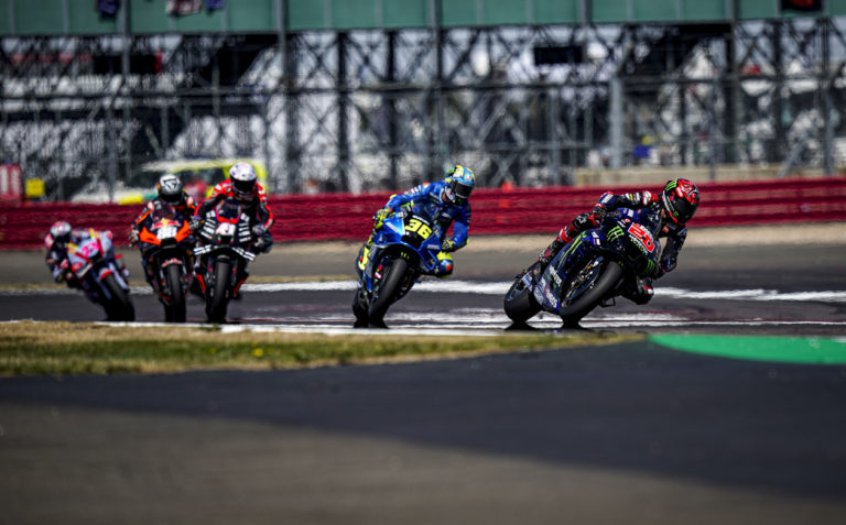 Five MotoGP racers racing on track