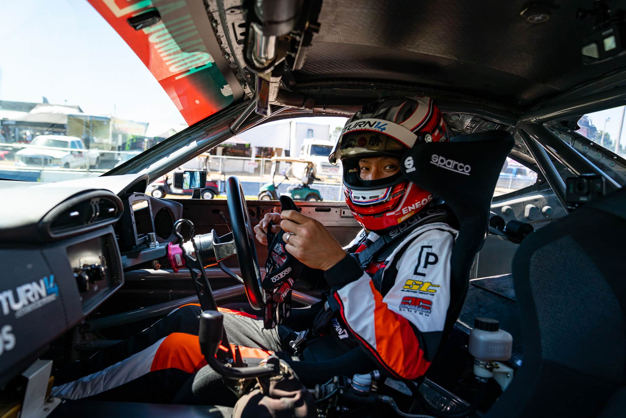 Dai sitting in Pit+Paddock race car