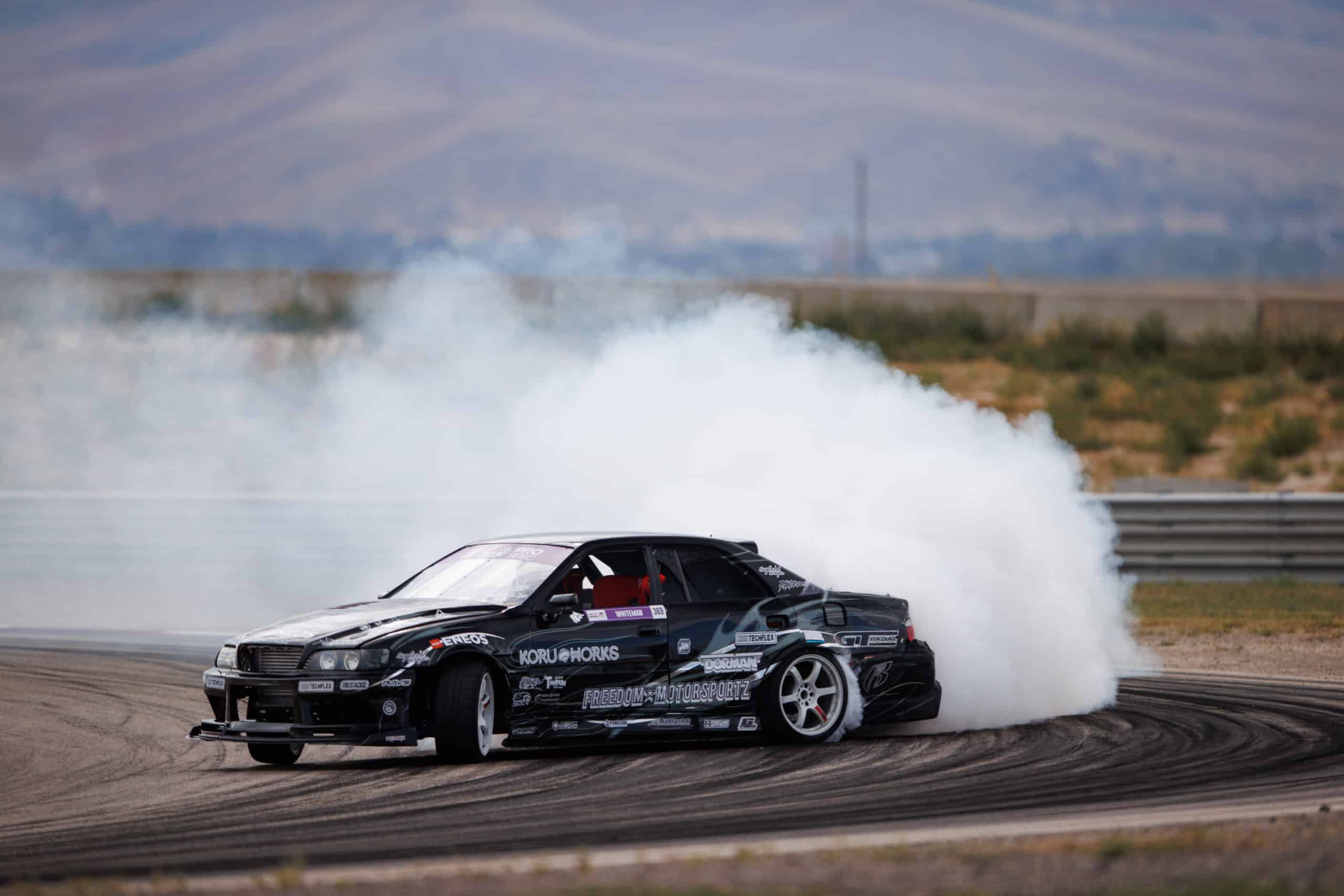 Formula Drift racer turning on track Formula Drift racer turning on track