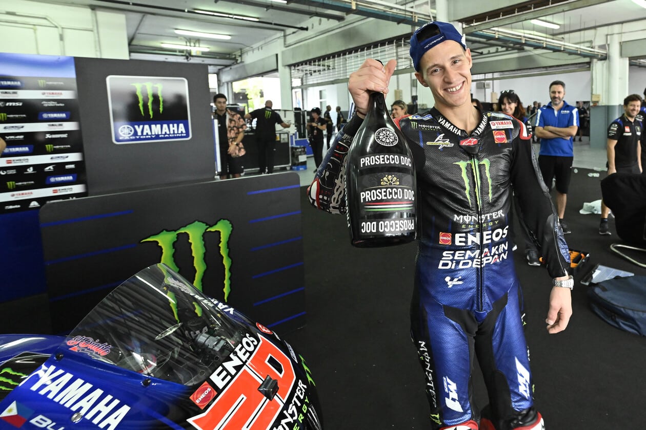 Quartararo holding Prosecco bottle