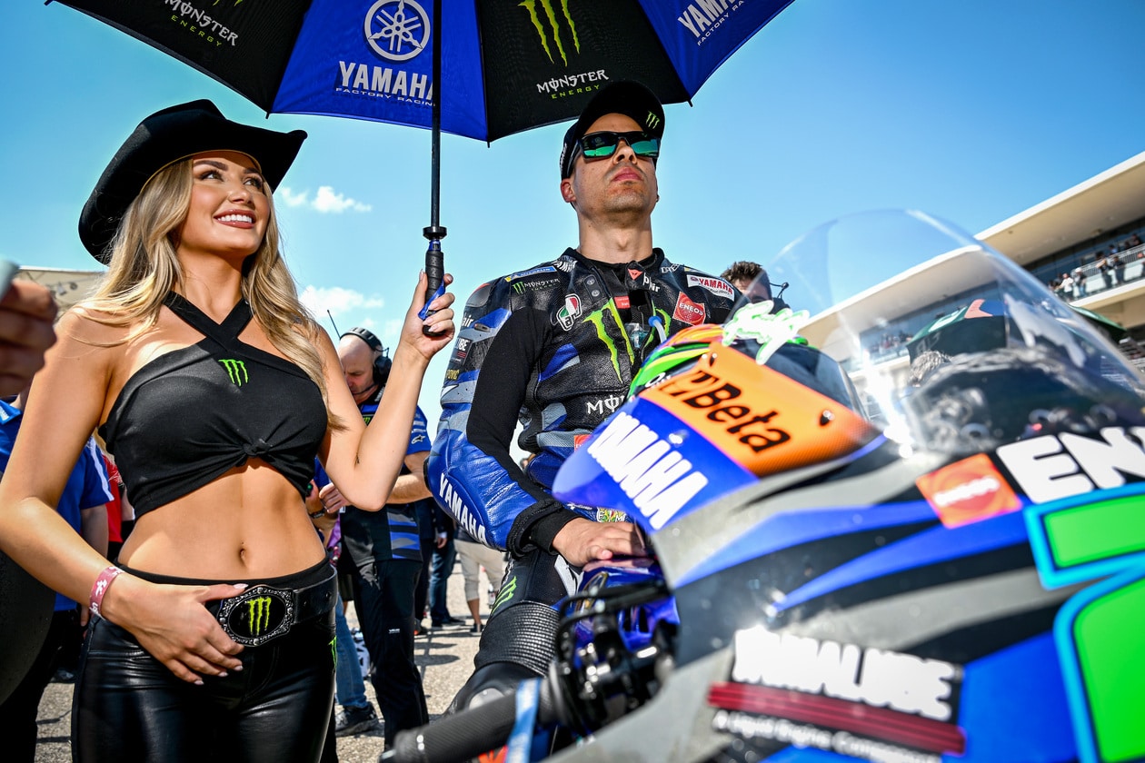 Quartararo posing with woman on MotoGP Bike