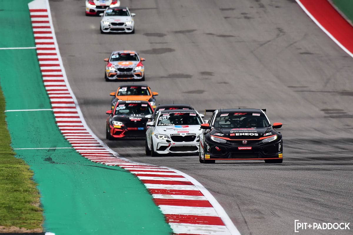 ENEOS Pit+Paddock Car in front of other cars