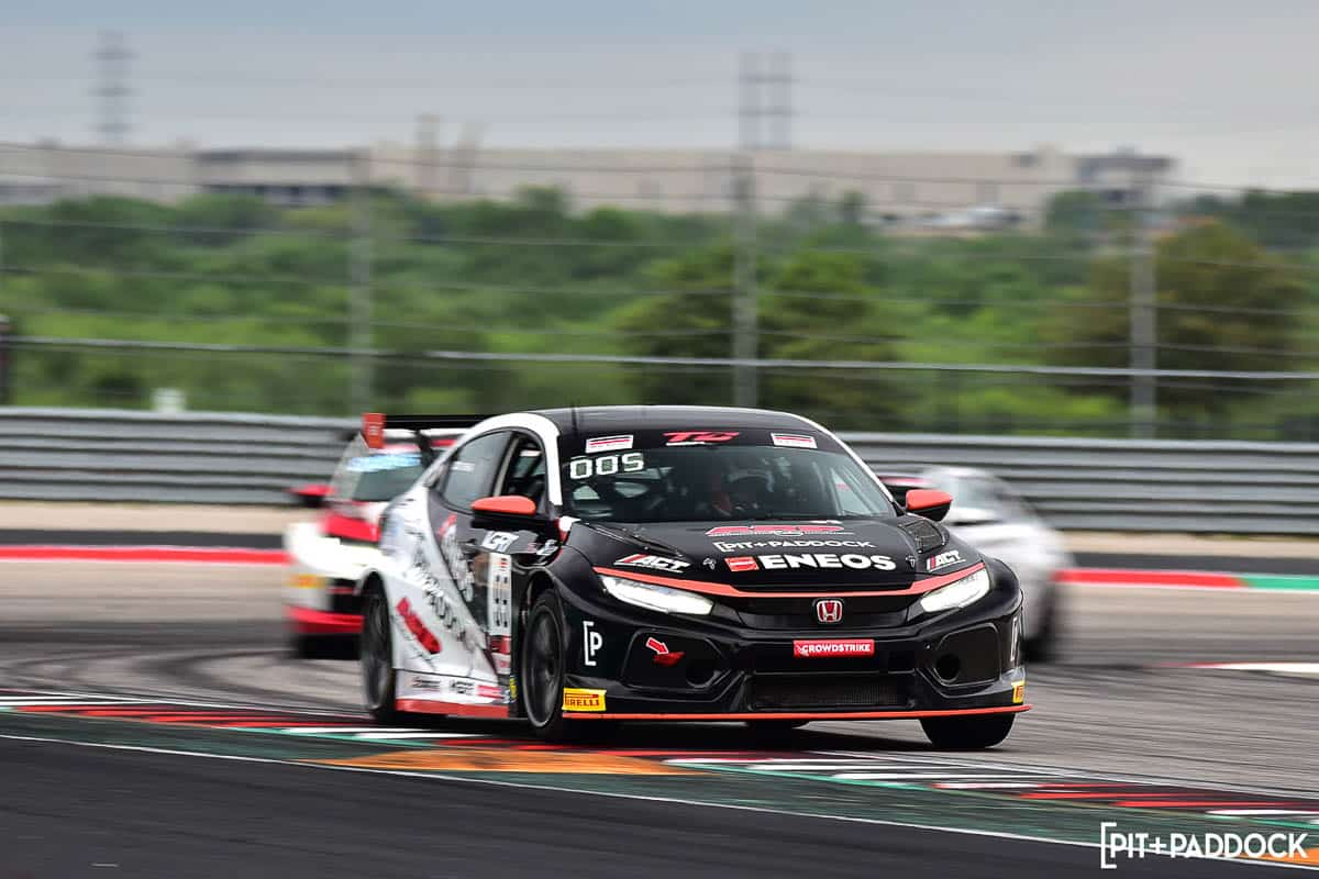 ENEOS Pit+Paddock Car in front of competitors