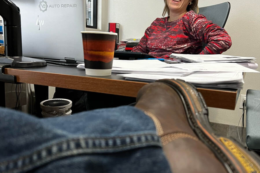 Woman laughing at desk