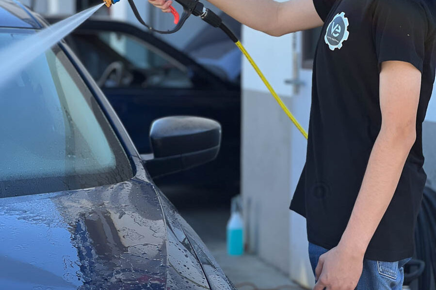 V&E Auto Repair employee washing car