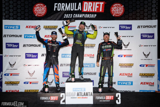 Formula DRIFT podium winners with trophies