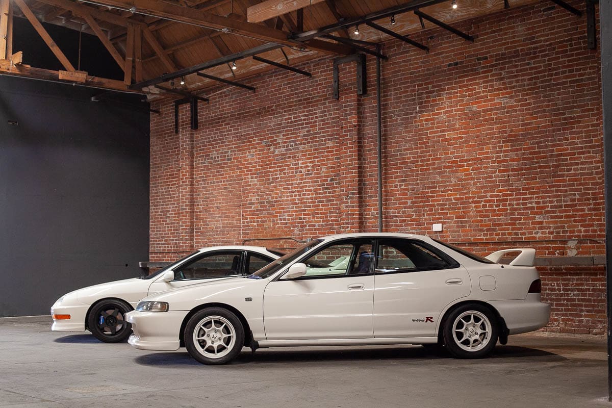 Two white cars side views