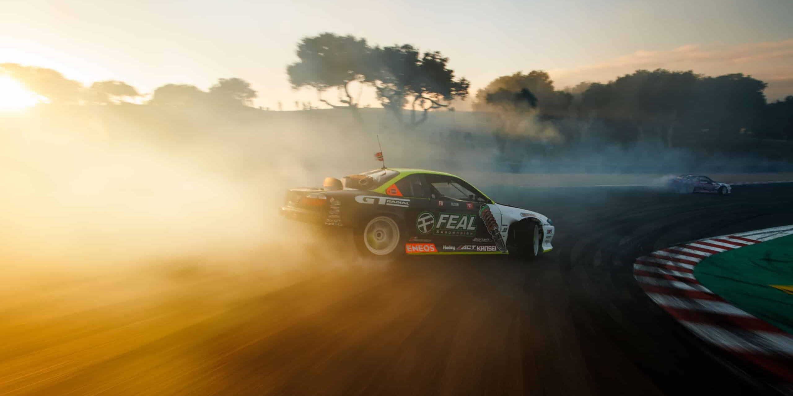 Simen Olsen drifting the Feal Nissan S14.9 down the Laguna Seca Corkscrew.