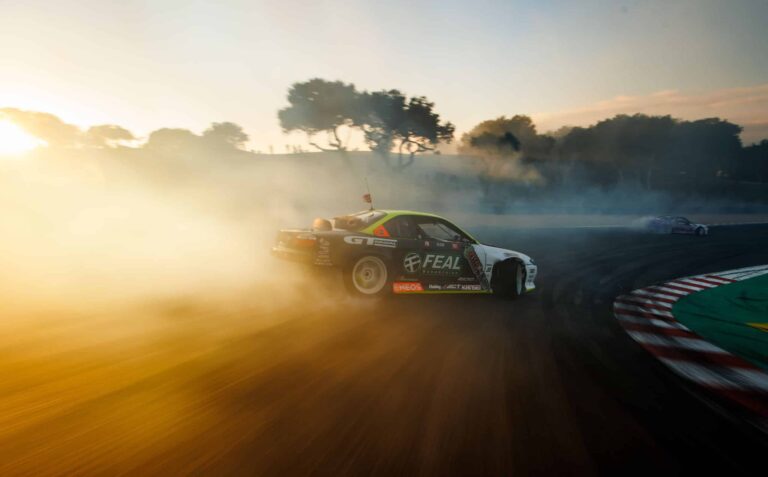 Simen Olsen drifting the Feal Nissan S14.9 down the Laguna Seca Corkscrew.