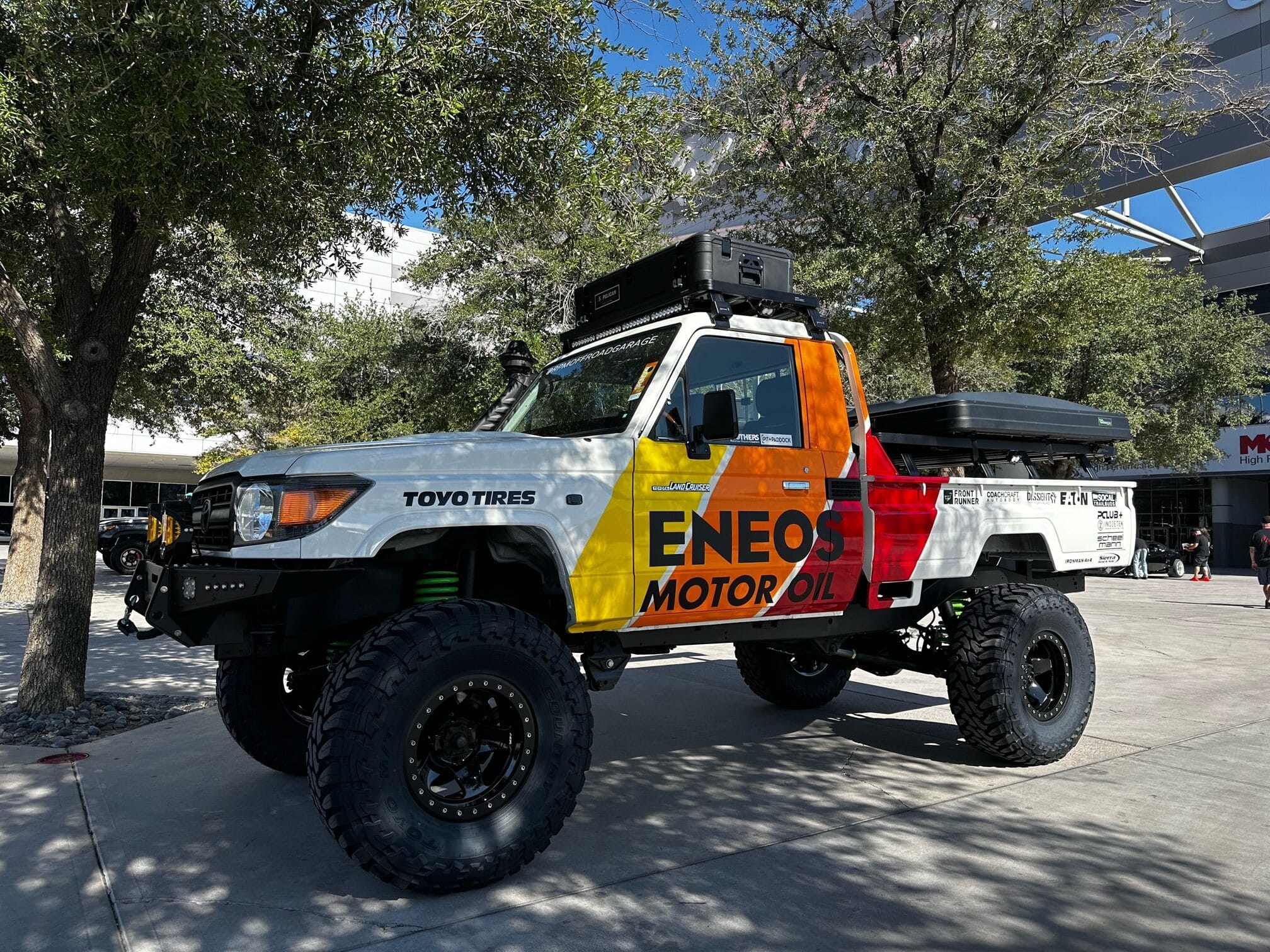 ENEOS Land Cruiser Pick Up RPM Off-Road Garage Land Cruiser 70/80 Series pickup in front of Central Hall at the 2023 SEMA Show.