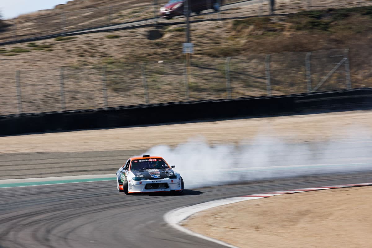 Odi Bakchis drifts the legendary Laguna Seca circuit. Odi Bakchis drifts the legendary Laguna Seca circuit.