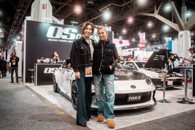 Hana Burton and Maaya Orido with the A’PEXi GR86 at the 2023 SEMA Show