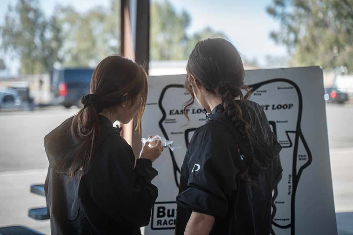 Maaya and Hana studying the Global Time Attack course layout