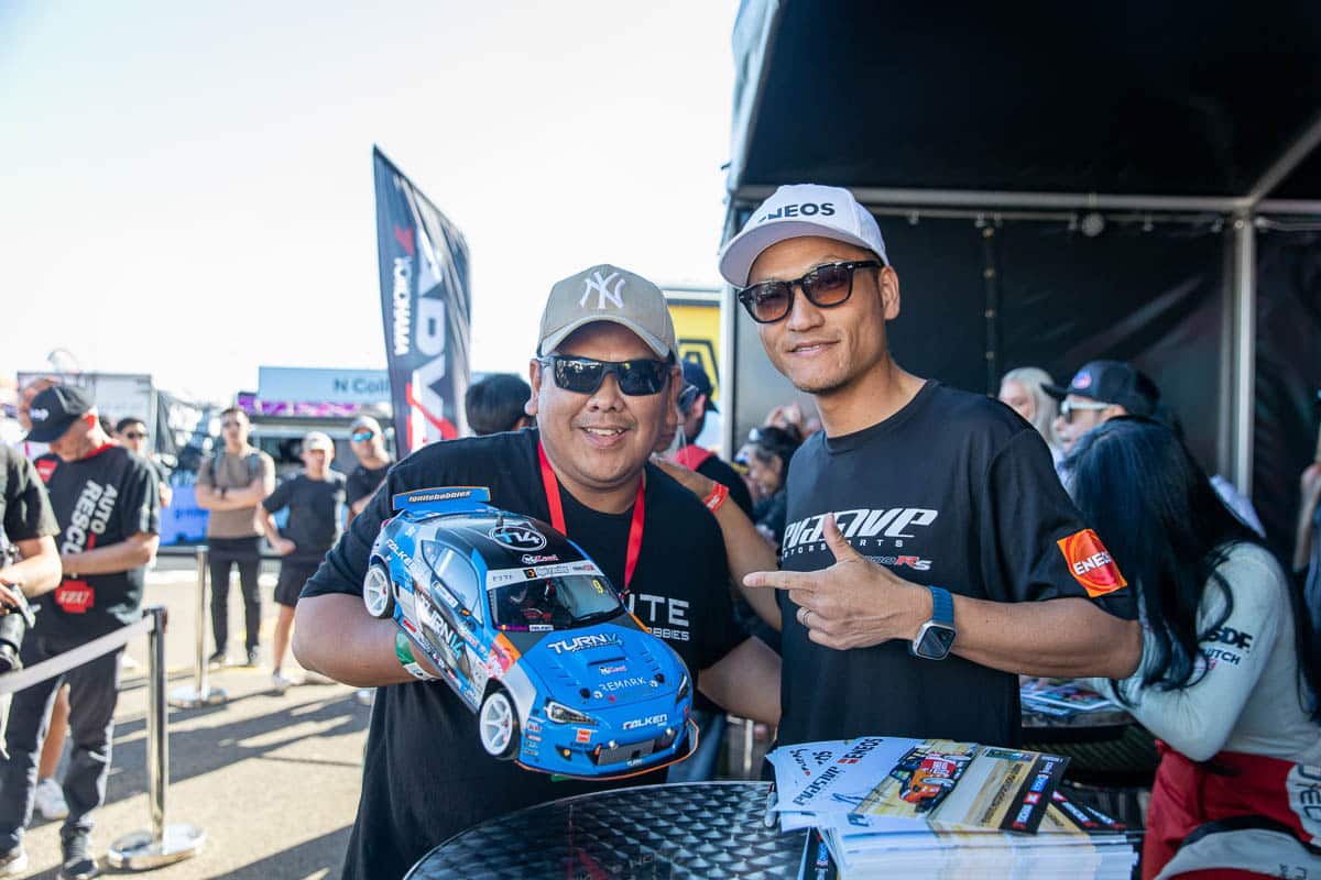 Dai signing his limited edition PRO BRZ R/C car for a fan, 2024 World Time Attack Challenge Dai signing his limited edition PRO BRZ R/C car for a fan, 2024 World Time Attack Challenge