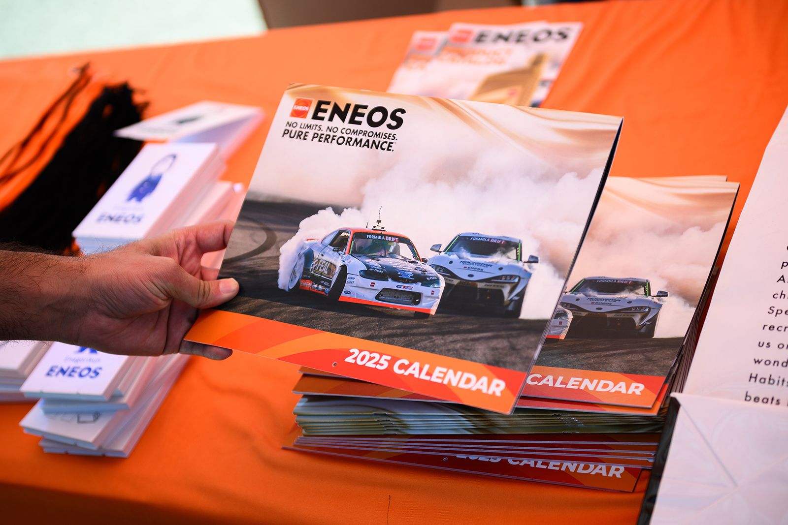 Get free ENEOS gear, like a 2025 calendar, at select stops this season; 2025 Formula DRIFT Long Beach